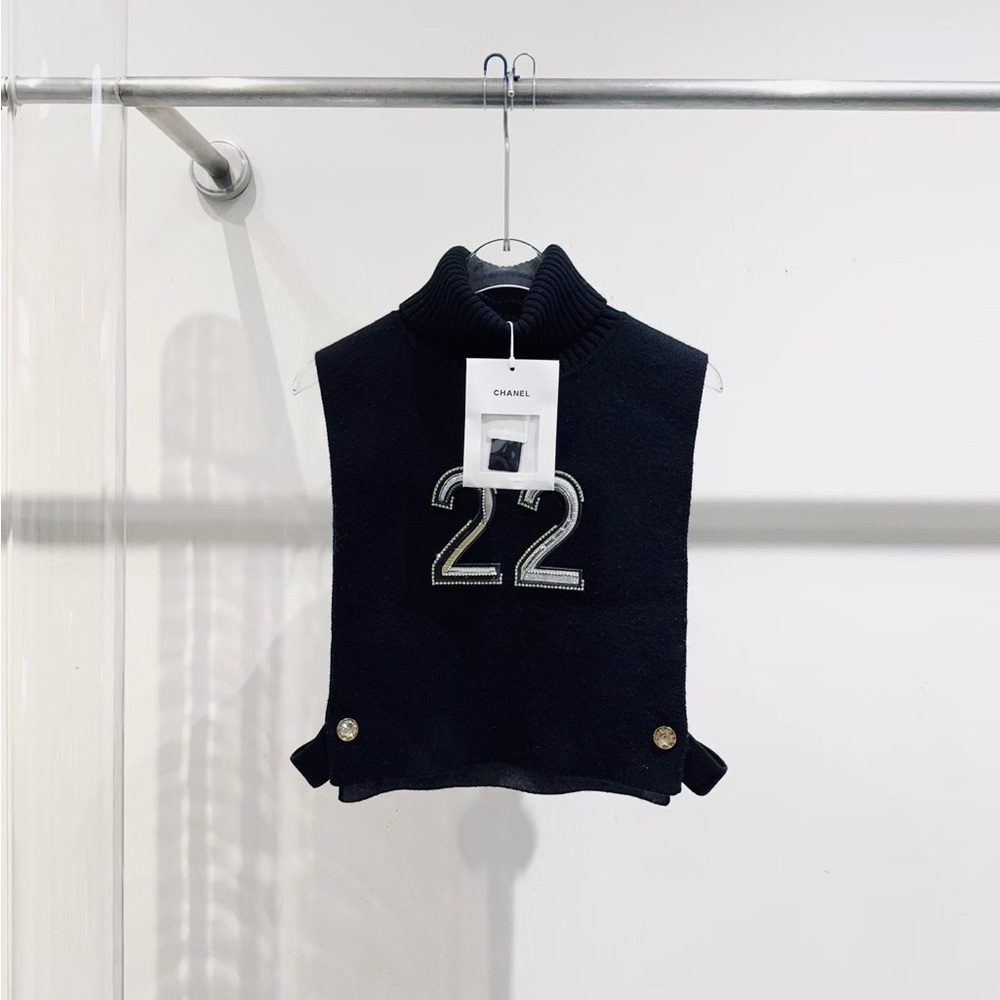 Authentic CHANEL Black Knit Sleeveless Mock Neck Front '22' Patch Vest